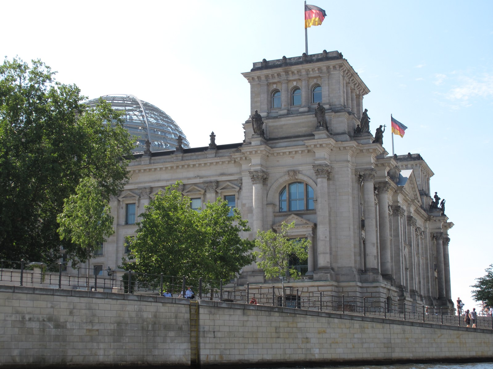 The Reichstag building in Berlin, seat of the German Bundestag, viewed from the Spree
